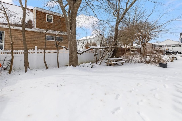 view of yard covered in snow