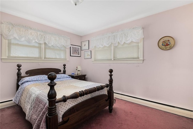 carpeted bedroom featuring a baseboard heating unit