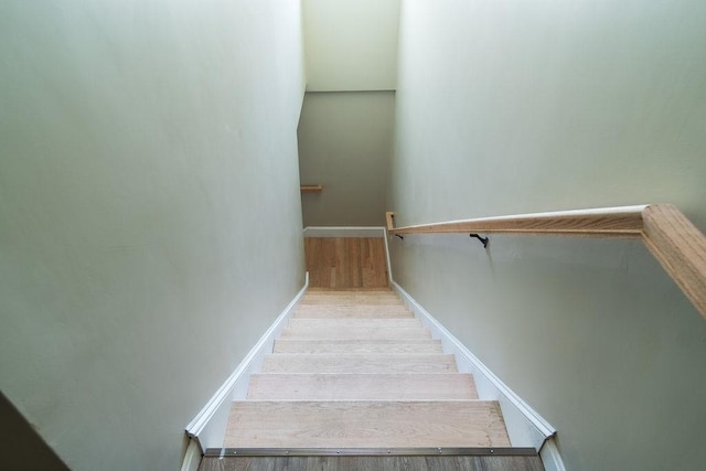 staircase featuring hardwood / wood-style flooring