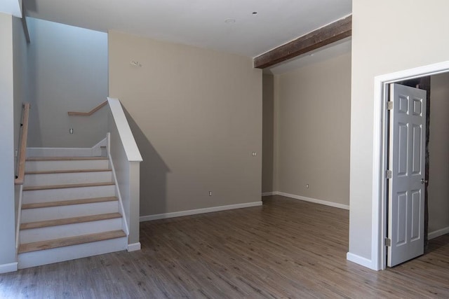 interior space with hardwood / wood-style flooring and beam ceiling