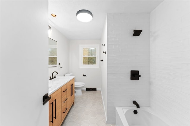 full bathroom with vanity, toilet, tiled shower / bath combo, and tile patterned flooring