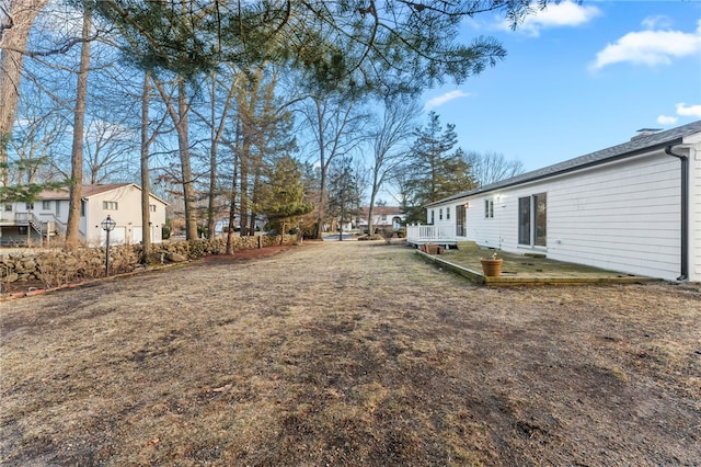 view of yard featuring a wooden deck