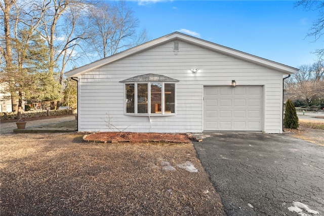 view of side of property with a garage