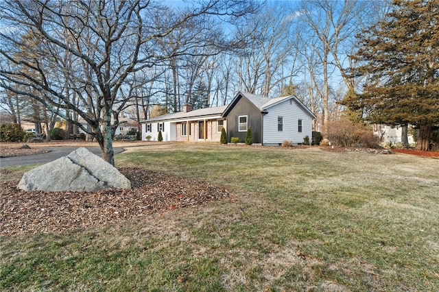 view of home's exterior with a yard