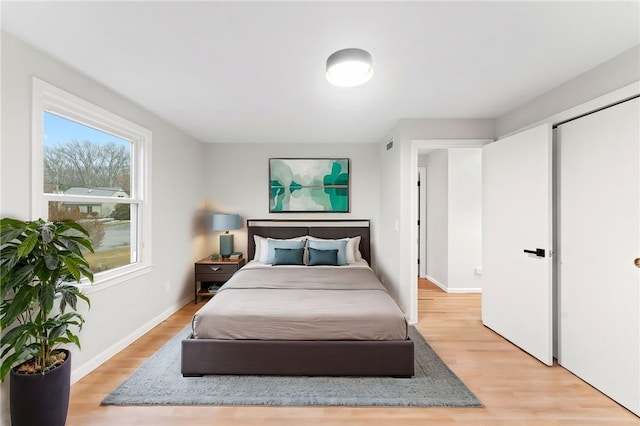 bedroom with light hardwood / wood-style flooring