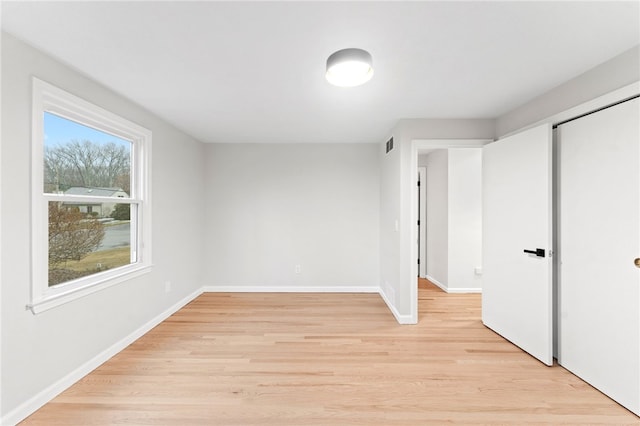 unfurnished bedroom featuring light hardwood / wood-style floors