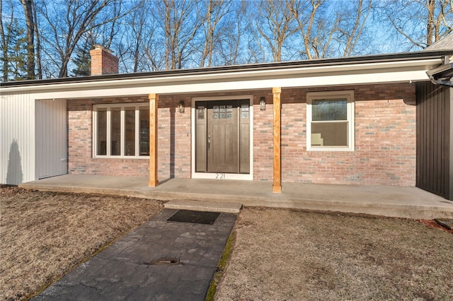 doorway to property featuring a patio area