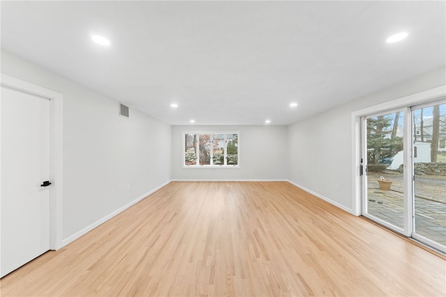 unfurnished room with light hardwood / wood-style flooring