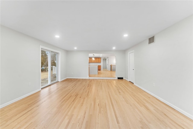 unfurnished living room featuring light wood-type flooring