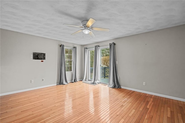 unfurnished room featuring ceiling fan and light wood-type flooring