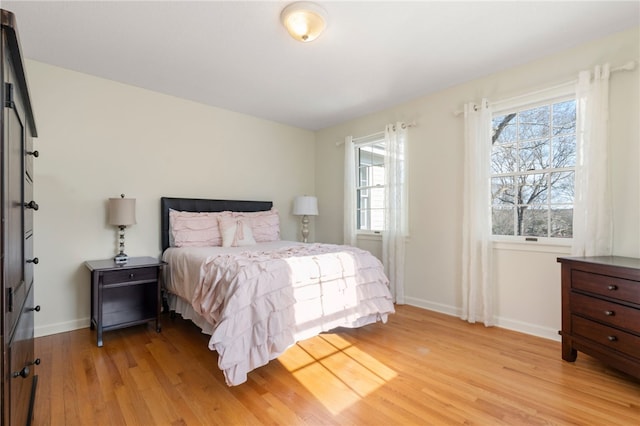 bedroom with light hardwood / wood-style flooring