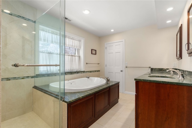 bathroom featuring tile patterned floors, vanity, and separate shower and tub