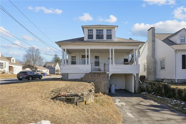 view of front facade with a garage and a porch