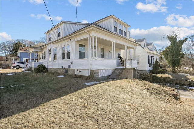 view of front of house featuring a porch and a front lawn