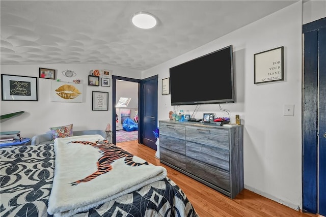 bedroom with light hardwood / wood-style floors