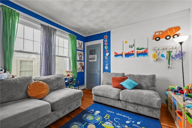 interior space featuring hardwood / wood-style floors and a baseboard heating unit