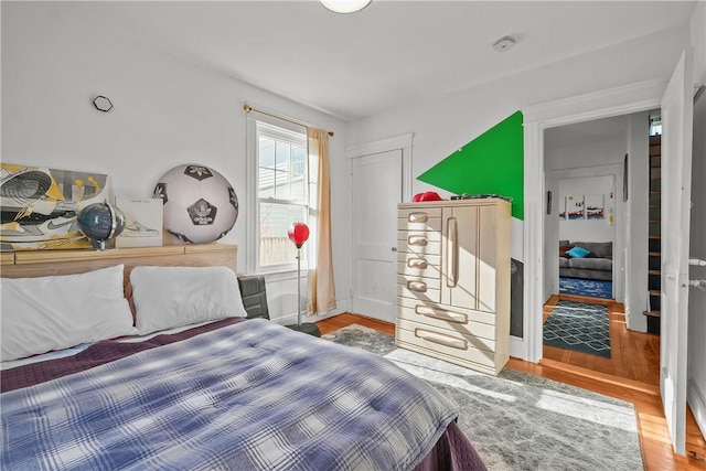 bedroom featuring wood-type flooring