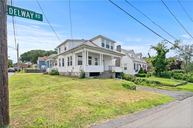 view of front of property with a front lawn and a porch