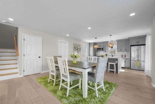 dining room with light hardwood / wood-style flooring