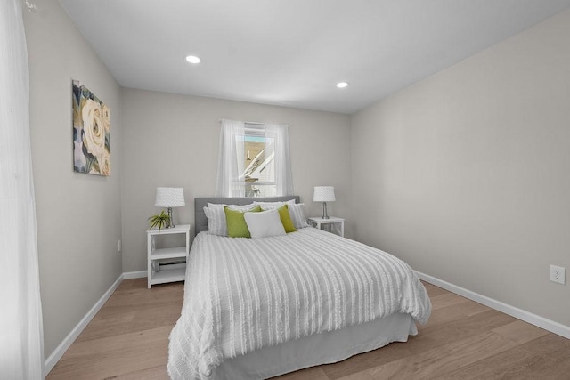 bedroom with light hardwood / wood-style flooring