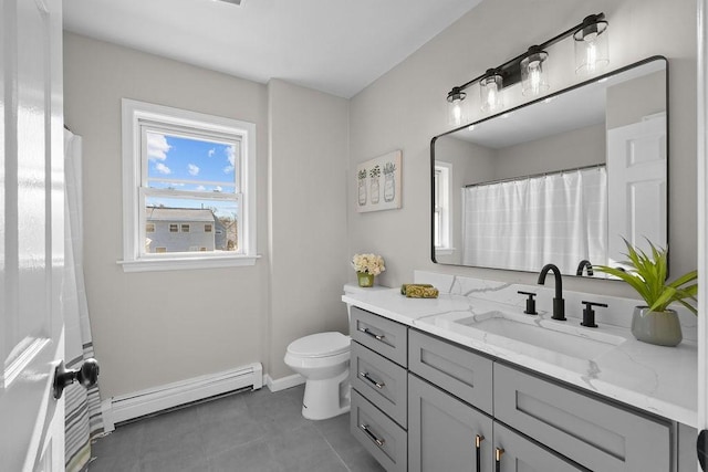 bathroom with vanity, tile patterned flooring, a baseboard radiator, and toilet