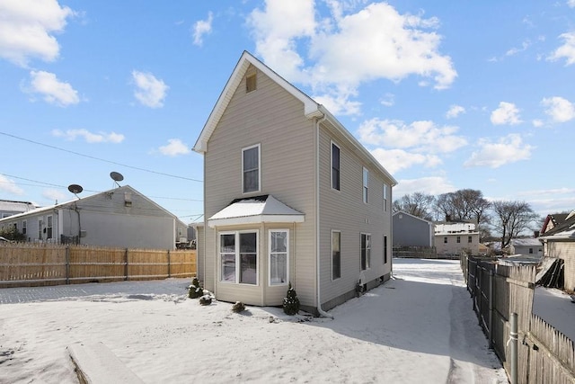 view of snow covered house