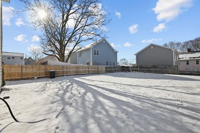 view of yard layered in snow