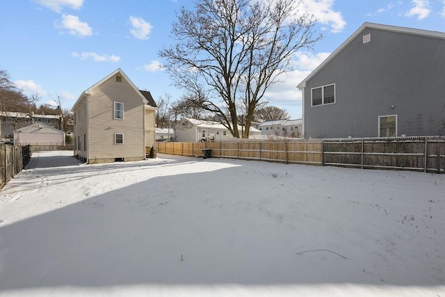 view of yard covered in snow