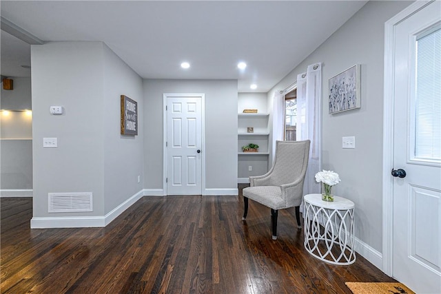 living area with dark hardwood / wood-style flooring