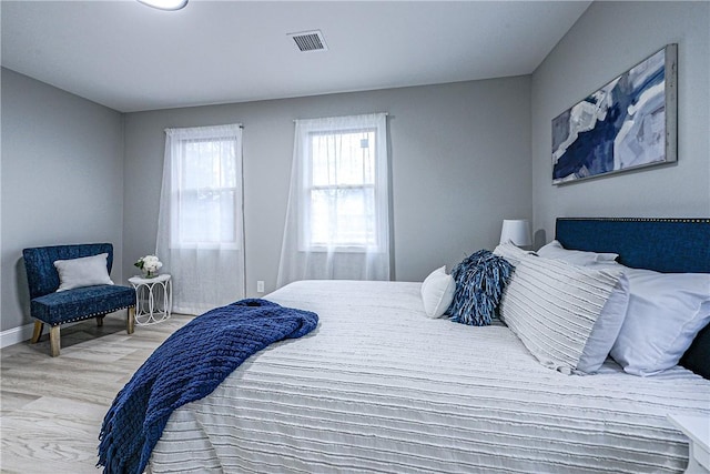 bedroom with light hardwood / wood-style flooring