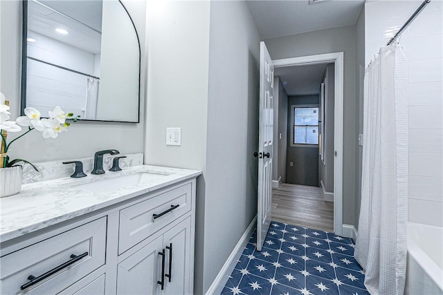 bathroom featuring shower / bath combination with curtain and vanity