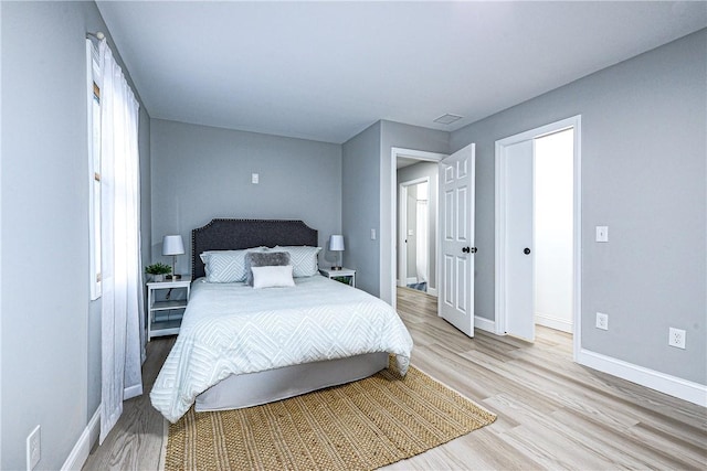 bedroom with light hardwood / wood-style flooring