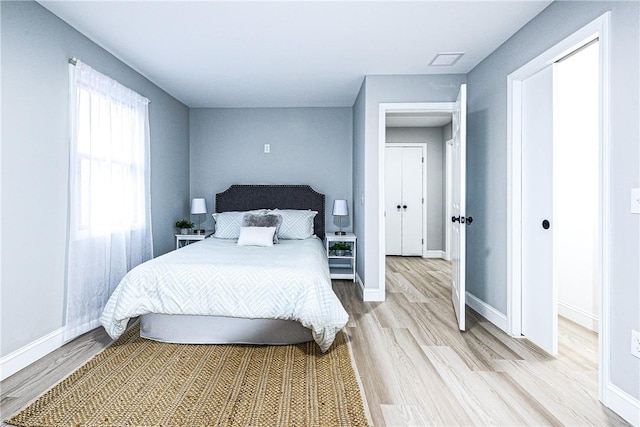 bedroom with wood-type flooring