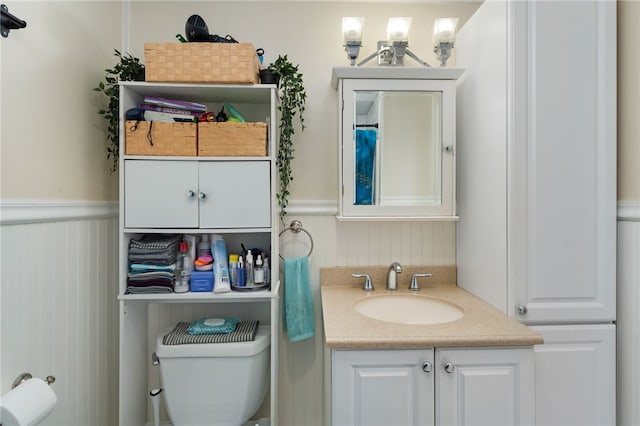 bathroom with vanity and toilet