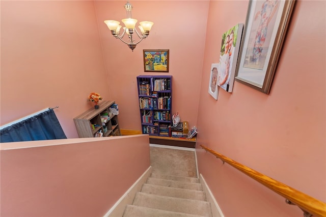 stairs featuring an inviting chandelier and carpet flooring