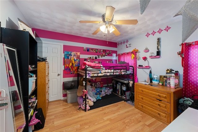 bedroom featuring ceiling fan and light hardwood / wood-style flooring