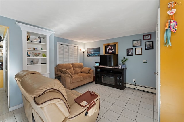 tiled living room featuring a baseboard radiator and a fireplace