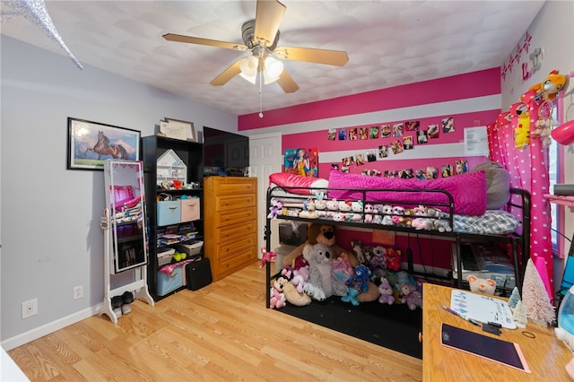 bedroom with wood-type flooring and ceiling fan