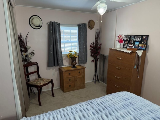 bedroom with light colored carpet and ceiling fan