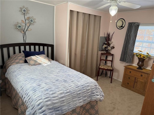 bedroom with ceiling fan and light colored carpet