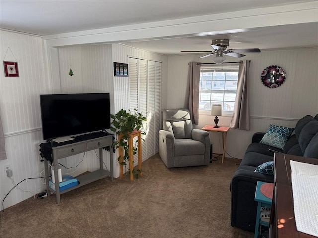 living room featuring carpet and ceiling fan