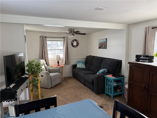 carpeted living room featuring ceiling fan