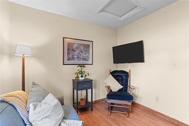 living area with hardwood / wood-style floors