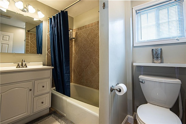 full bathroom with shower / bath combination with curtain, vanity, and toilet