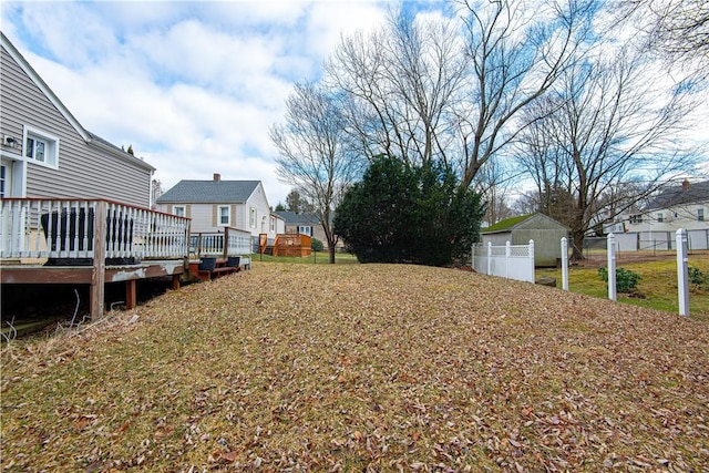 view of yard featuring a wooden deck