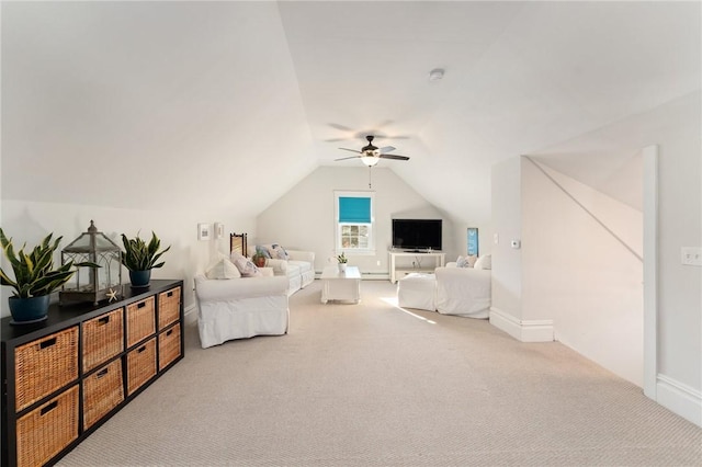 carpeted bedroom with ceiling fan, a baseboard radiator, and vaulted ceiling