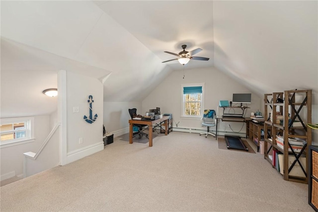 carpeted home office featuring a baseboard heating unit and vaulted ceiling