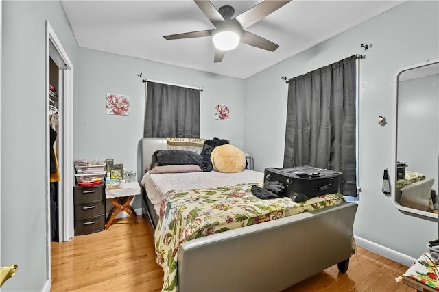 bedroom with ceiling fan and light wood-type flooring