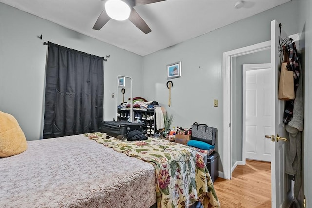 bedroom featuring ceiling fan and wood-type flooring