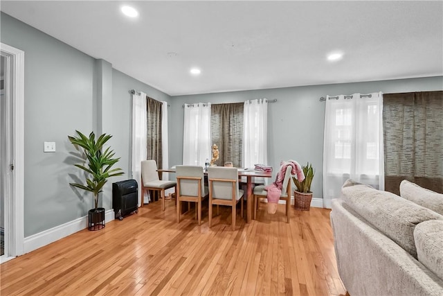 dining area featuring light wood-type flooring